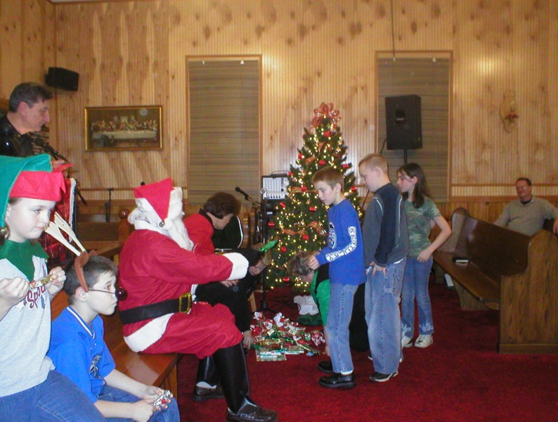 Santa giving gifts.JPG